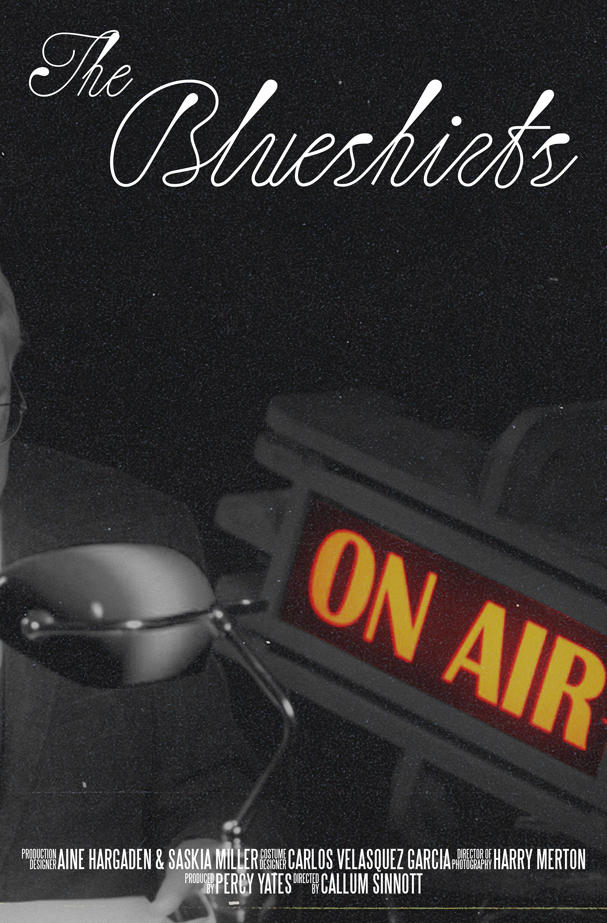 A poster for the Blueshirts Documentary featuring a vintage style Bankers lamp and an illuminated red "ON AIR" sign in front of a shadowy black backdrop.