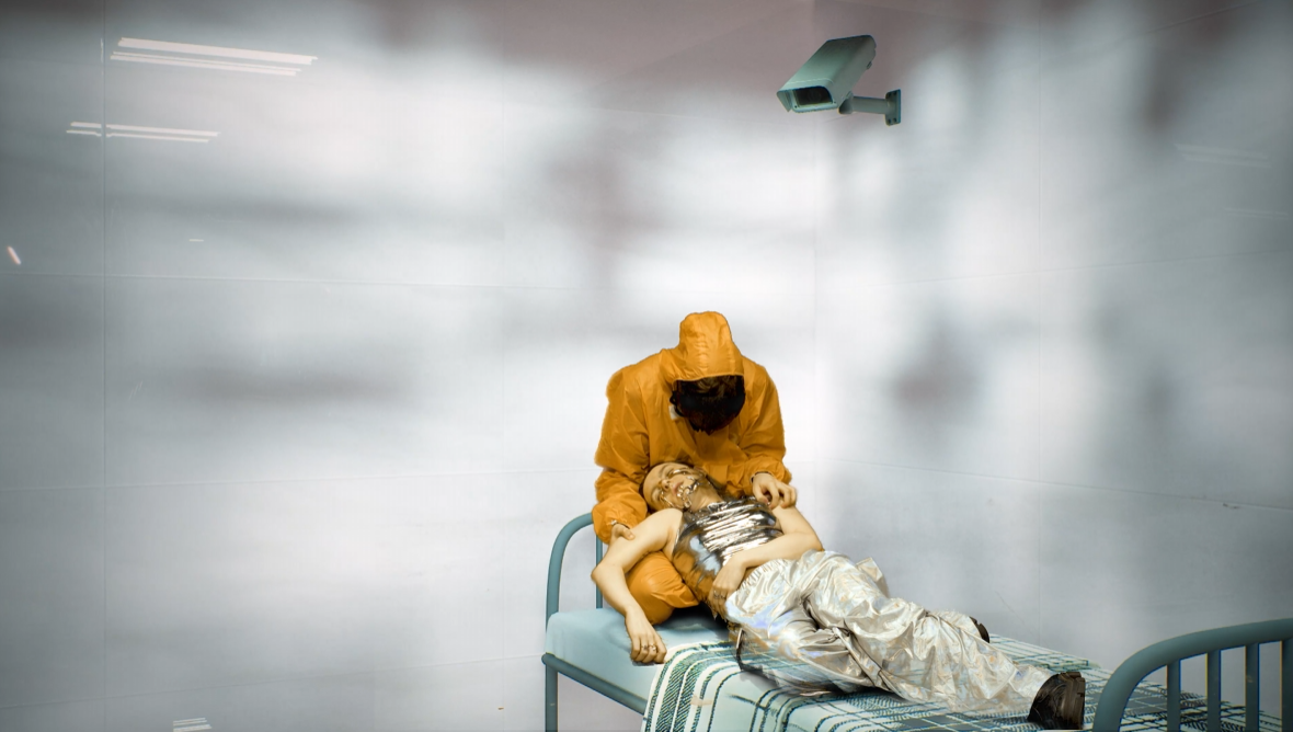 a man and woman on a bed. the woman is unconscious with her head laying on his lap