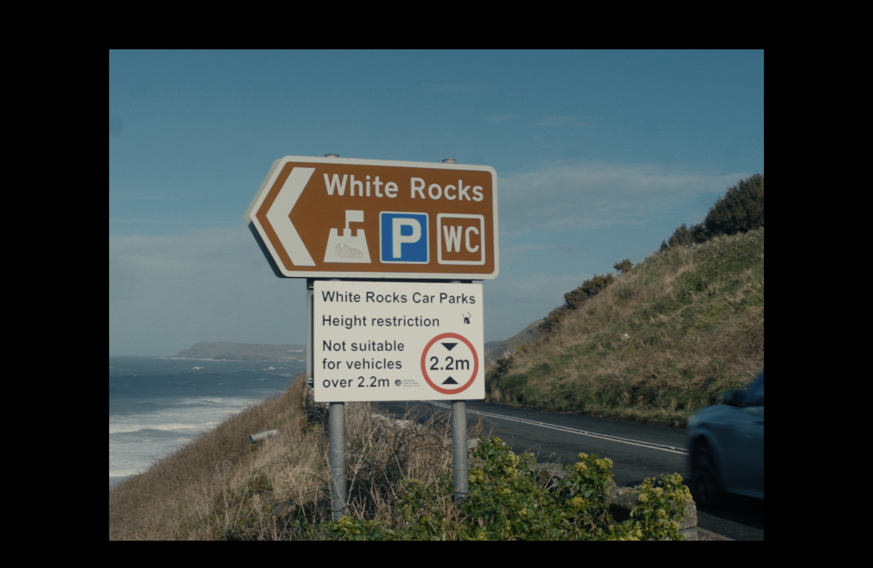 Still A Place to Stand - white rocks beach sign