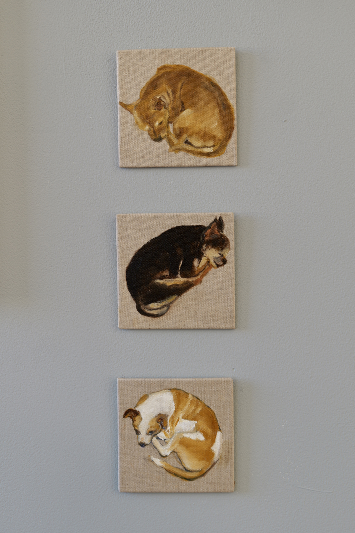 3 small paintings of dogs