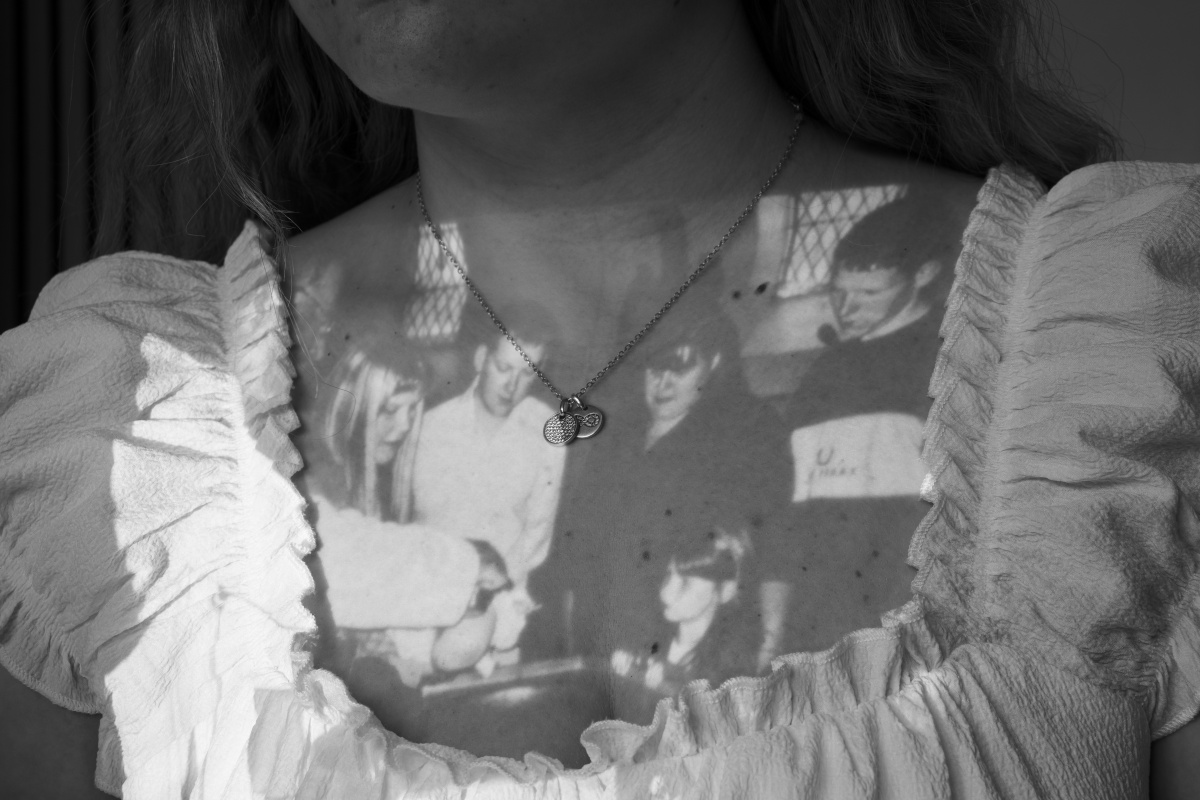 archival image projected onto artists chest