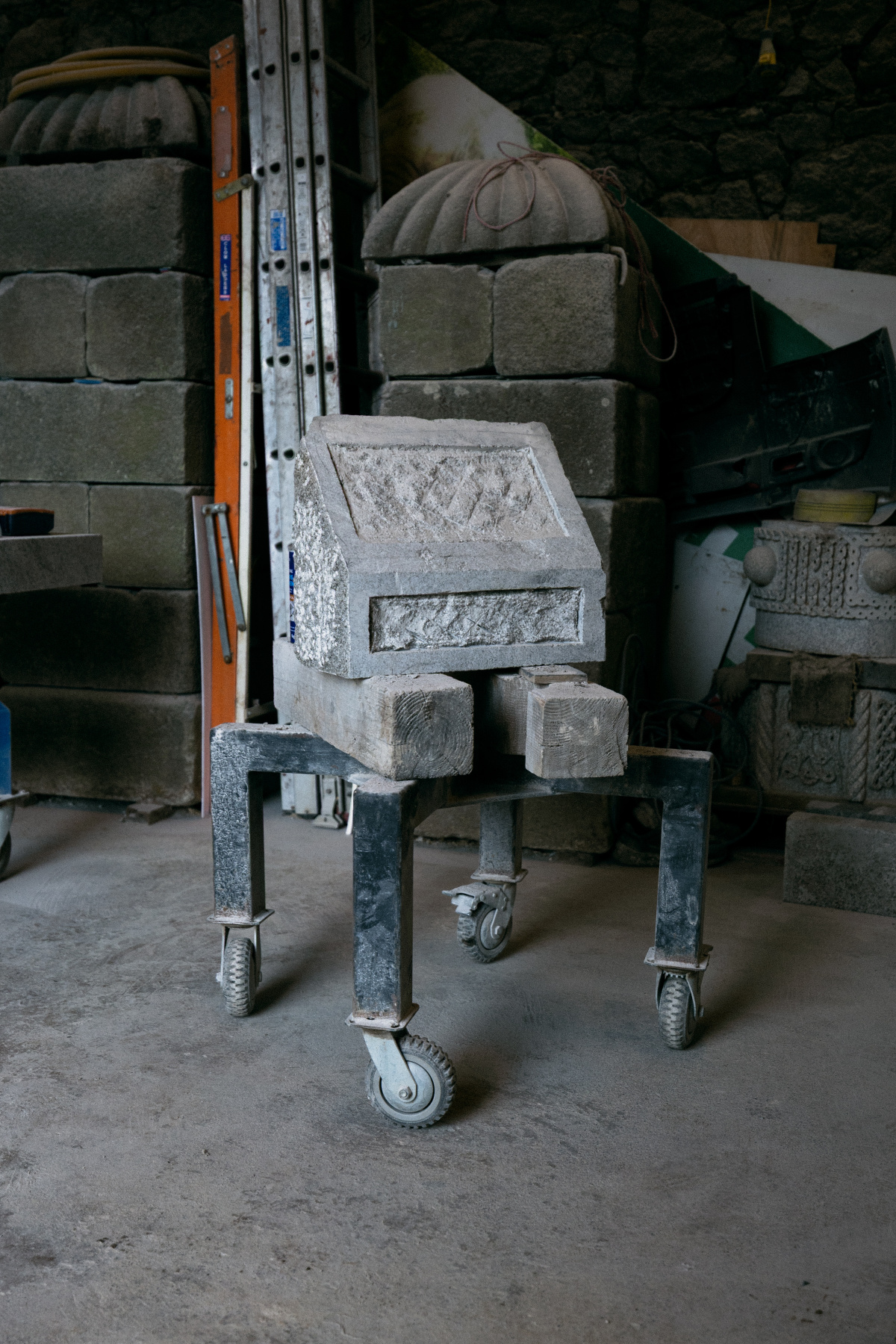 A hand carved piece of granite on a Dolley