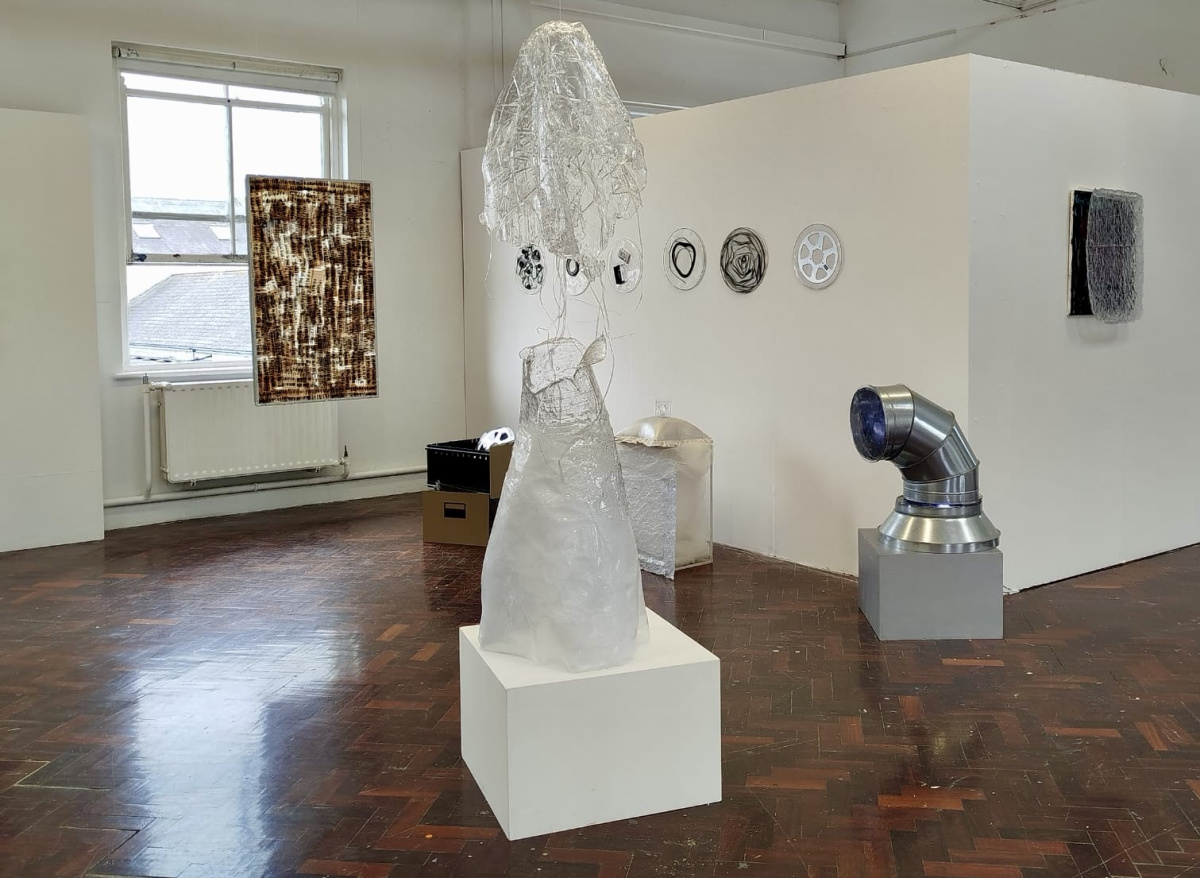 Marie Noonan, **R_dact_d**, 2026, found objects,paper, epoxy resin sculptures, light and sound, dimensions variable.