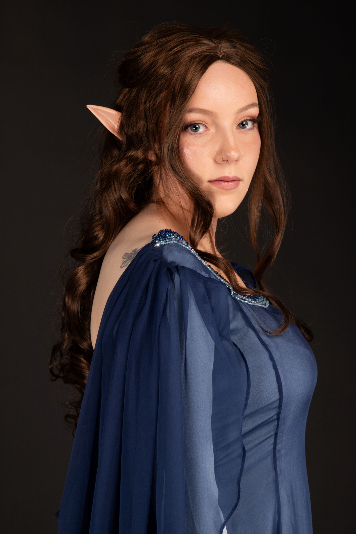 Portrait of Ellen Farquhar, showcasing the beading on the dress. Modelled and makeup done by Ellen Farquhar and photographed by Sarah Lordan.