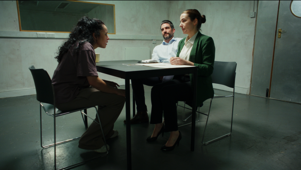 Elena is questioned by two detectives