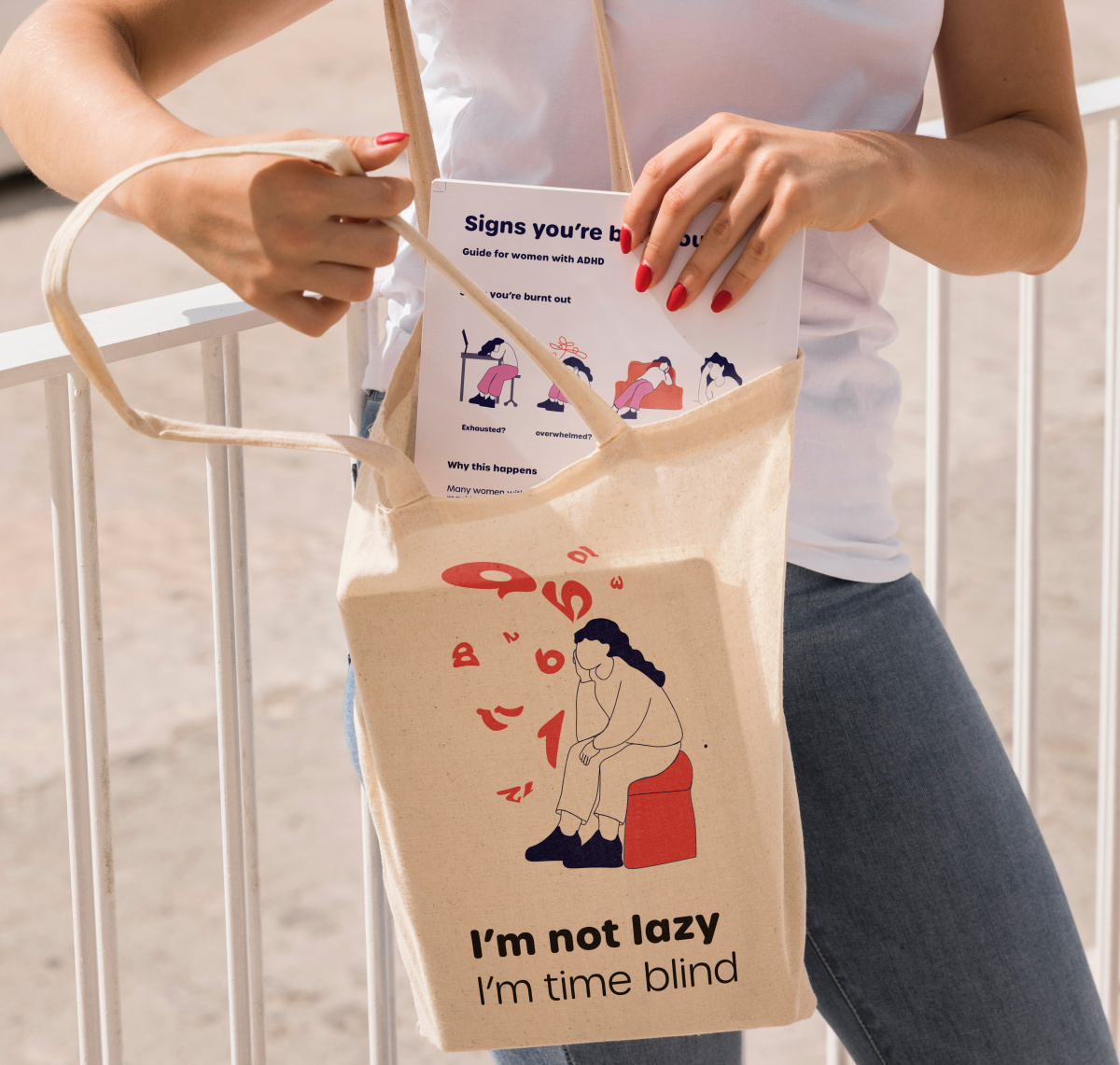Tote bag and printed guide featuring burnout awareness messaging designed to support women with ADHD.