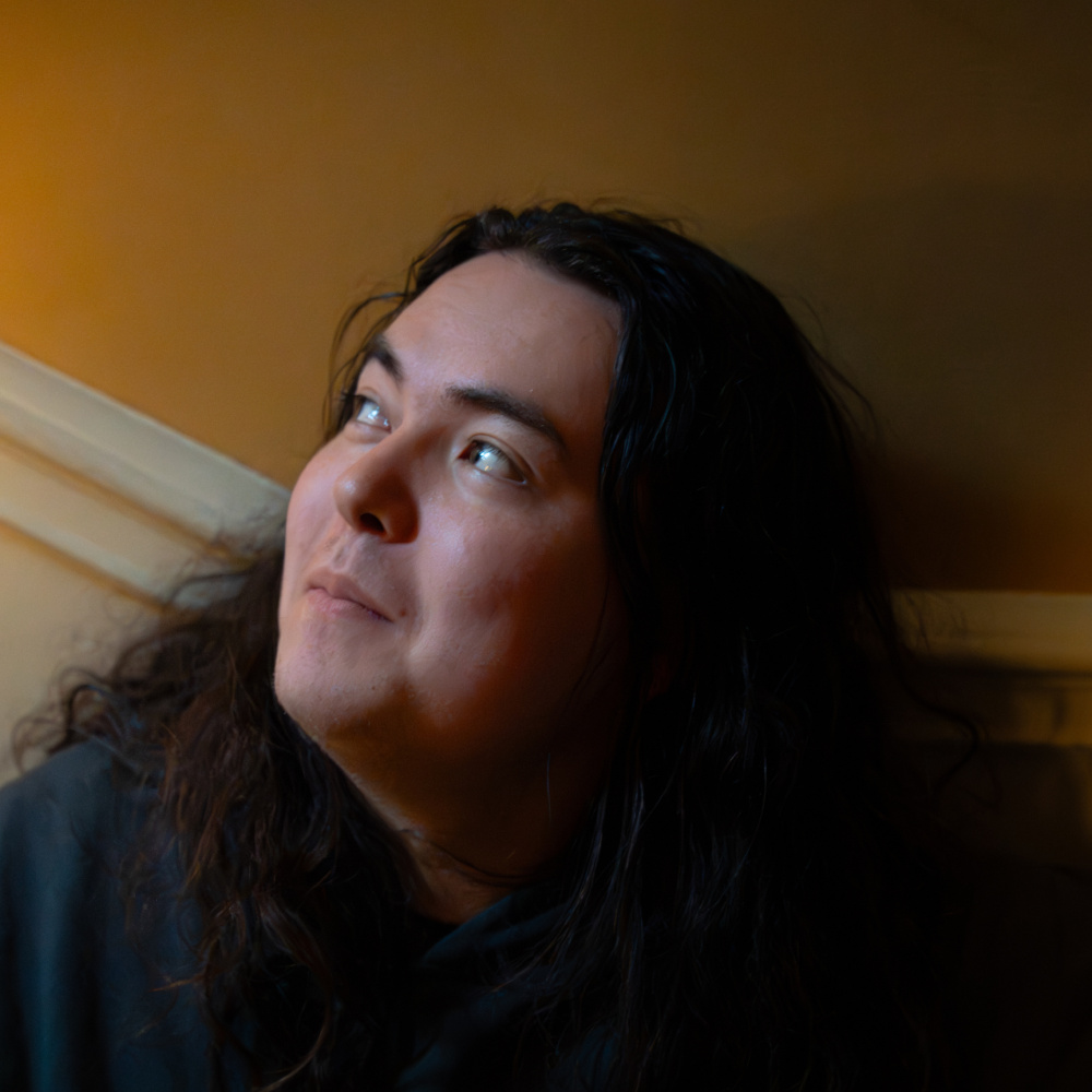 Kai Kobayashi Ryan profile image looking up and to the left